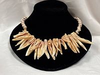 Full view of necklace on display bust