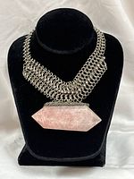Full necklace on display bust showing chain width and rose quartz pendant