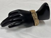 Bracelet displayed on mannequin hand showing overall look and width