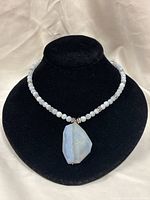 Full view of beaded jasper necklace on display bust