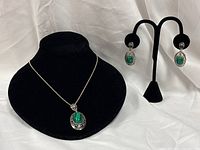 Necklace and earrings displayed together showing overall set