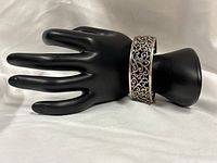 Bracelet on display hand showing overall form and style