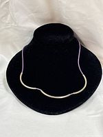 Necklace on display bust highlighting sterling tube centerpiece