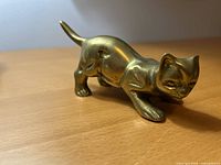 Right side view of brass cat figurine