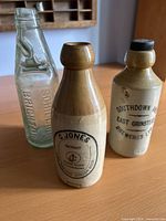 Front view of all three bottles showing size and markings