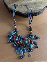 Full view of necklace showing design and colours
