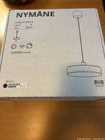 Closed box showing product name, illustration, size and specs