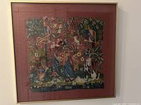 Full view of framed needlepoint artwork