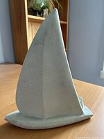 Front view of stone sailboat sculpture