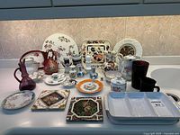 Group shot of all ceramic, porcelain and glass items on countertop