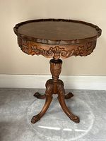full view of carved pedestal side table