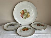 front view showing platter and stacked dessert plates