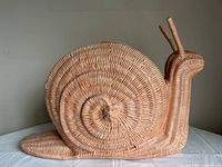 Full left side view of wicker snail magazine holder