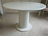 full view of round white lacquer table