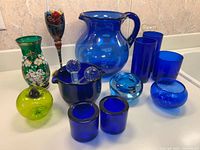 group shot of all cobalt blue glass items
