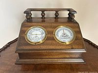 Front view showing both dials on wood case