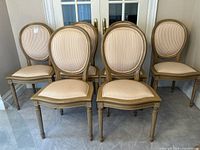 Front view of six matching upholstered dining chairs