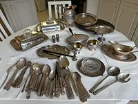 Overview of all silver plate items on table