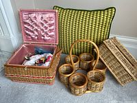 All four items group shot; sewing box open showing interior and notions, cup caddy, cushion, lidded tray