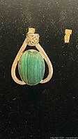 Front view of sterling silver pendant with green malachite cabochon