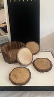 Set of wood coasters and holder front view