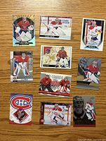Fronts of ten Carey Price hockey cards laid out on wood surface
