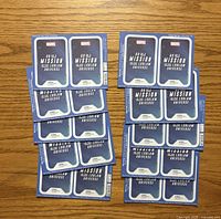 Stacks of blue sealed Marvel Loblaws card packs on wood surface