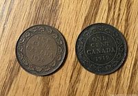 Reverse sides showing dates 1920 and 1919 with vine-leaf border