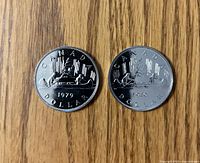 1979 and 1980 Canada dollar reverse sides showing voyageur design