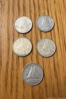 Reverse of all five Canadian 10-cent silver coins showing Bluenose schooner designs