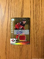 Front of Dillon Dube autographed jersey card displaying autograph, jersey swatch, numbering