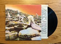 Front of gatefold jacket with vinyl partially exposed