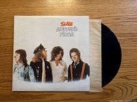 Front cover and vinyl partially out of sleeve