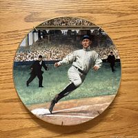 Front view of decorative plate showing Ty Cobb artwork and gold trim
