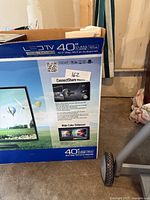Retail box front showing Samsung 40-inch LED TV image and branding