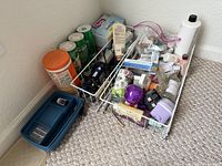 Overall view of lot showing baskets, wipes, tissue box, curling iron and assorted toiletries