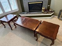 Coffee table and both end tables in front of fireplace