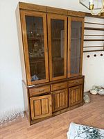 Full view of hutch showing glass upper doors and wood lower doors