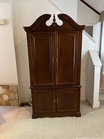 Front view showing full entertainment center with four doors