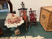 Overall lot showing both rocking chairs, cello, violin, bows and straw hat on stand