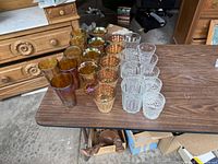 Group shot of all amber and clear tumblers on table