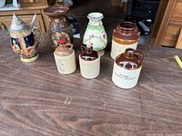 Group view of all seven stoneware pieces on table