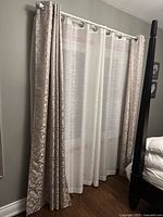 Panels hung on rod showing overall appearance and grommet header