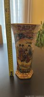 Full view of vase beside tape measure showing 10 in height