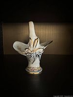 Front view showing bow detail and gold trim