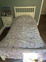 Duvet cover on twin bed showing overall Samantha pattern