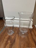 Front view of both clear glass vases side by side