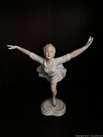 Front view of porcelain figure skater on heart-shaped base