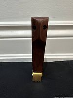 front view showing owl face and brass opener