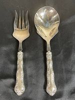 Fork and spoon full view showing handles and heads